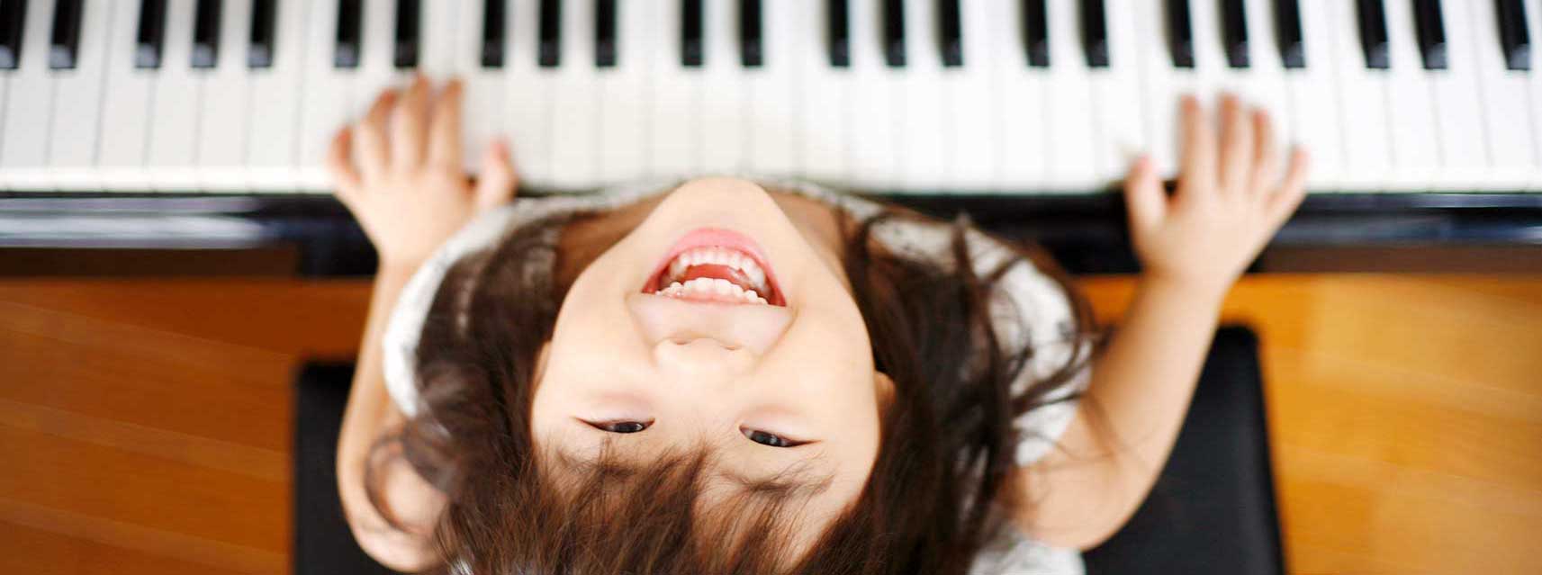 happy girl at piano